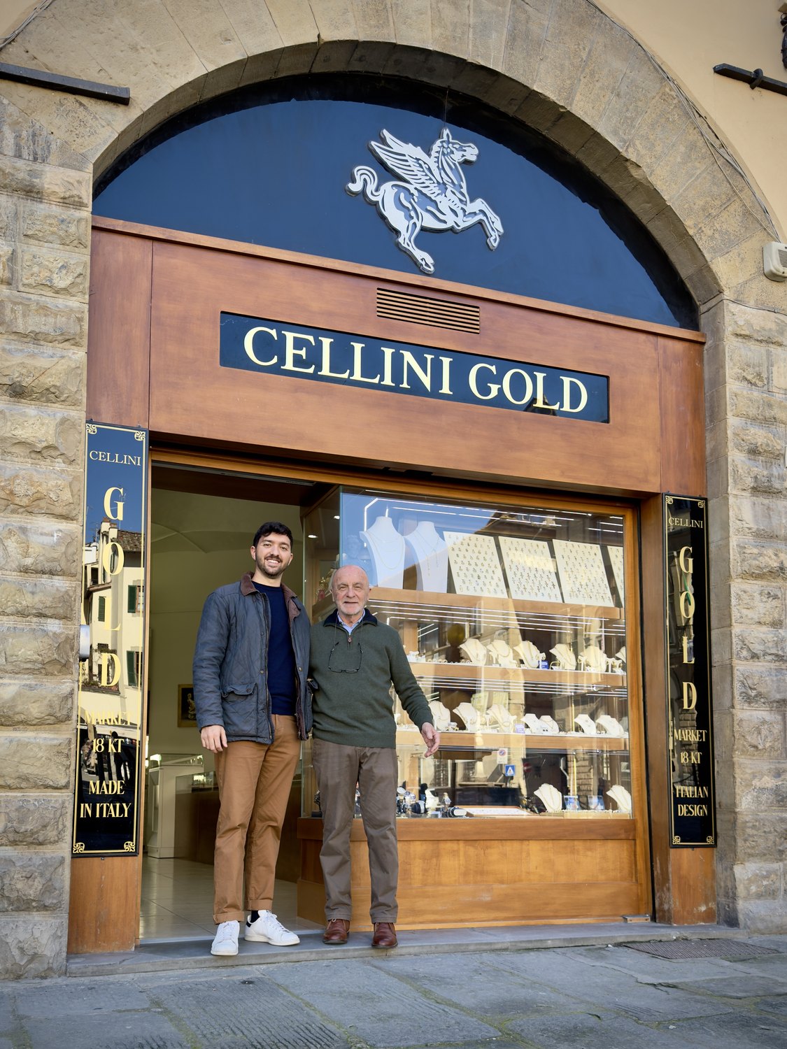 Father and son in front of their gold jewellery shop in Florence